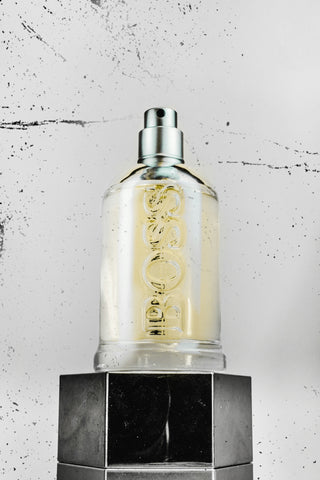 gold and black perfume bottle