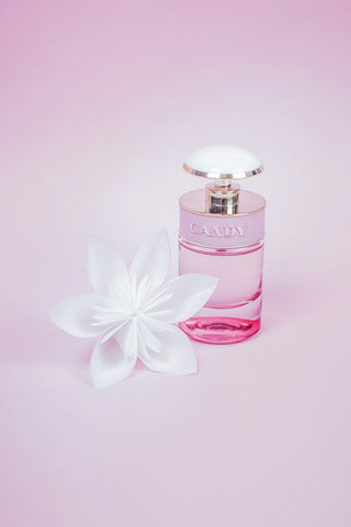 pink perfume bottle with white flower