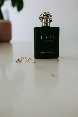 a bottle of perfume sitting on top of a table